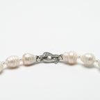Roman Numeral Patterned Saltwater Pearls with Dzi Bead