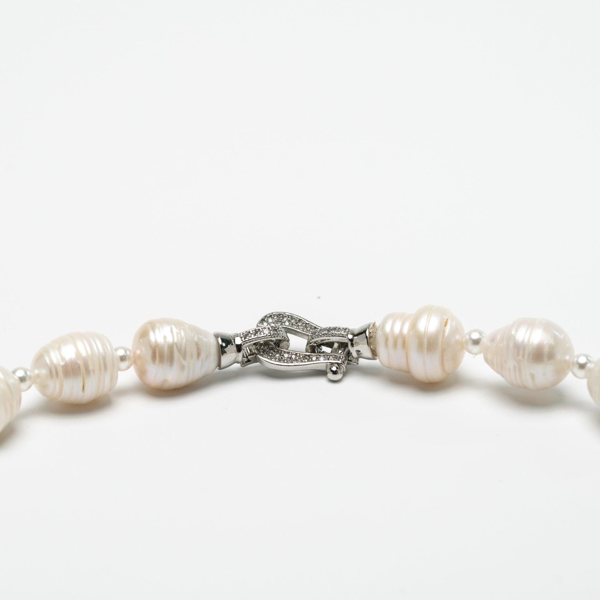 Roman Numeral Patterned Saltwater Pearls with Dzi Bead